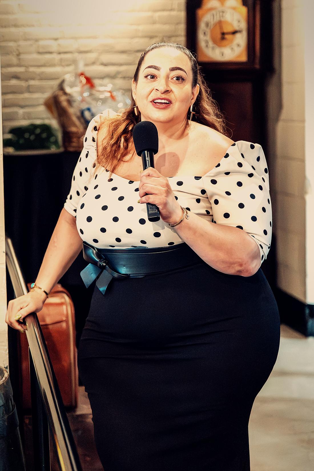 A singer at the microphone, mid-song.